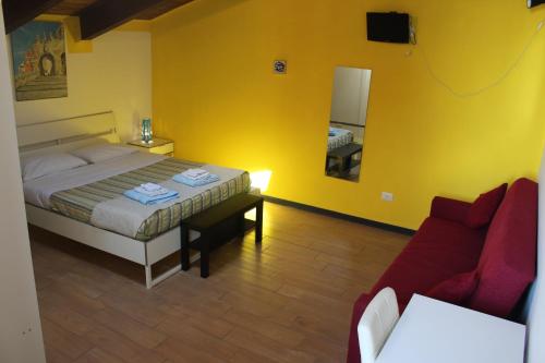 Postel nebo postele na pokoji v ubytování B&B Oasi al Mare