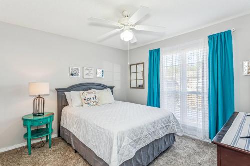 a bedroom with a bed and a ceiling fan at 8347 Shipton St in Navarre
