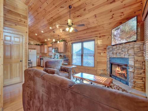 a living room with a couch and a fireplace at Magic Moments II in Gatlinburg