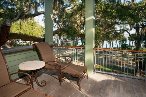 a rocking chair and a table on a porch at River View 3 Bedroom Wilson Village Home 70 in Bluffton