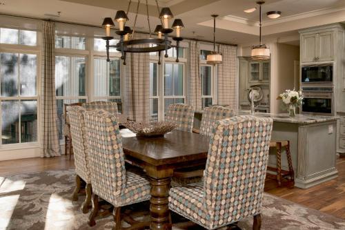 a dining room with a wooden table and chairs at River View 3 Bedroom Wilson Village Home 70 in Bluffton