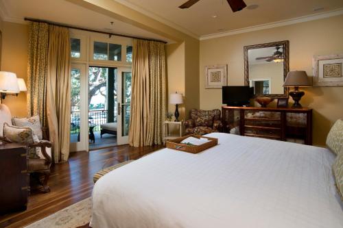 a bedroom with a large bed and a living room at River View 3 Bedroom Wilson Village Home 70 in Bluffton