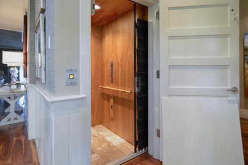 a door leading into a hallway with wood paneling at River View 3 Bedroom Wilson Village Home 70 in Bluffton