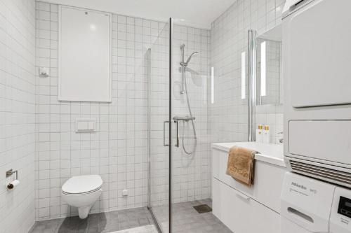 a bathroom with a shower and a toilet and a sink at 5,1sq mts room -Forests cozy house in Stavanger