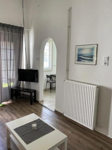 Televízia a/alebo spoločenská miestnosť v ubytovaní Harmath-Szabó Apartman