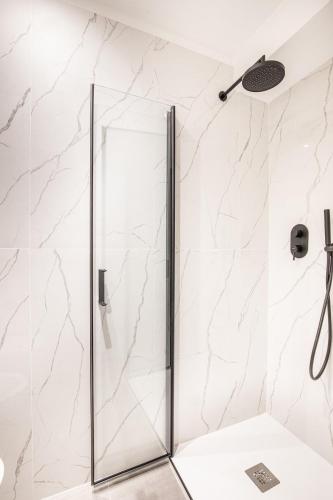 a shower with a glass door in a bathroom at Eldorado,Romantic Seafront Getaway in Manarola