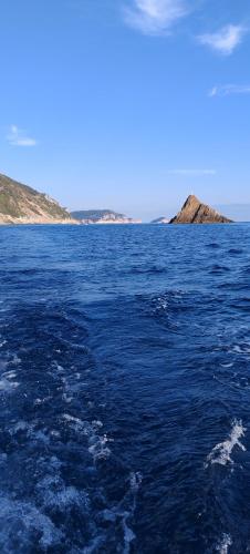 a large body of water with islands in the distance at A Casa Di Gaia in Riccò del Golfo di Spezia