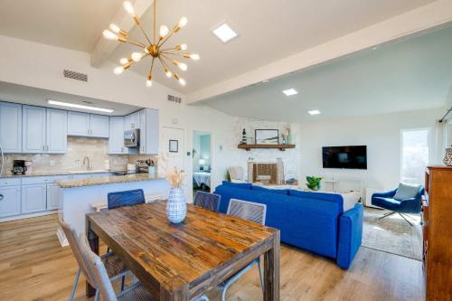 a kitchen and living room with a table and a blue couch at Sunset Ridge 2King Beds Lake Hot Tub Pool in Canyon Lake