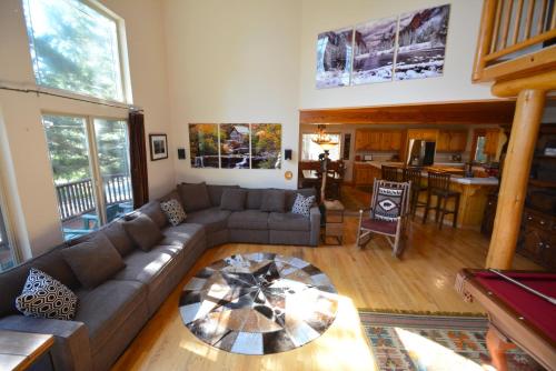 a living room with a couch and a table at Black Bear Lodge Reduced Nightly Rate in Bass Lake