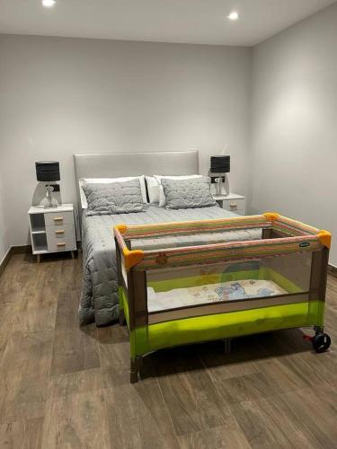 a bedroom with a bed and two night stands at Rincón do Seves in Tomiño