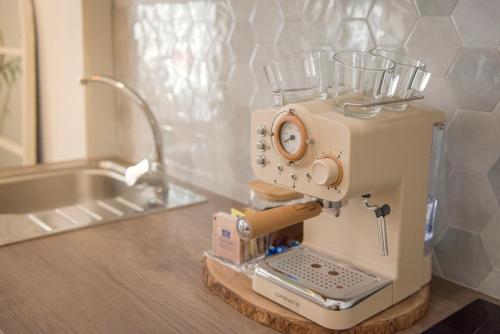 a sewing machine sitting on a counter in a kitchen at Agua Viva Deluxe in Málaga