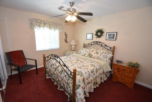 a bedroom with a bed and a ceiling fan at Forward-lake Area in Bass Lake
