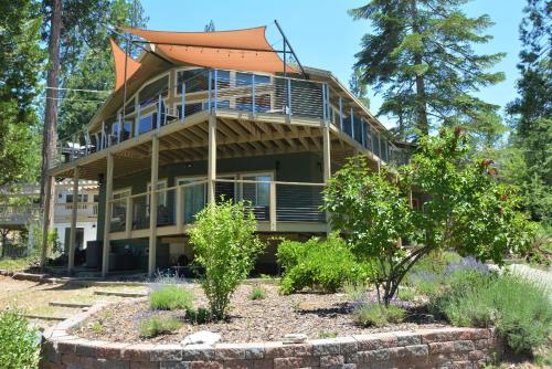 a large house with an orange roof at Werner Lake Front in Bass Lake