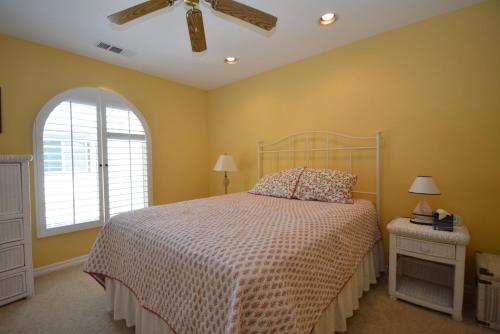 a bedroom with a bed and a ceiling fan at King- Lake Area in Bass Lake