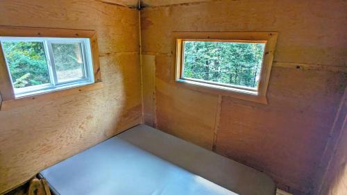 Katil atau katil-katil dalam bilik di Les Refuges Perchés Mont-Tremblant