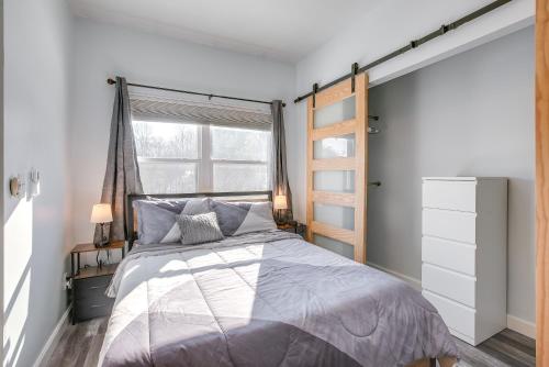 a bedroom with a large bed and a window at 4 Mi to Lake Logan Hocking Hills Apartment in Logan