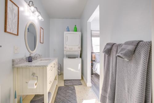 a white bathroom with a sink and a refrigerator at 4 Mi to Lake Logan Hocking Hills Apartment in Logan