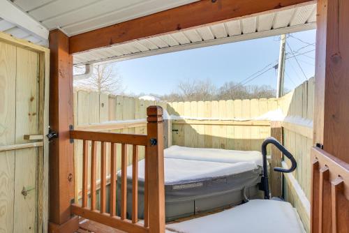a porch with a bed and a fence at 4 Mi to Lake Logan Hocking Hills Apartment in Logan