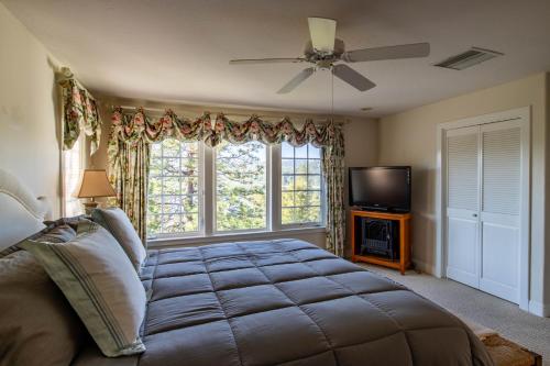 a bedroom with a large bed and a window at Falls Lake View in Bass Lake