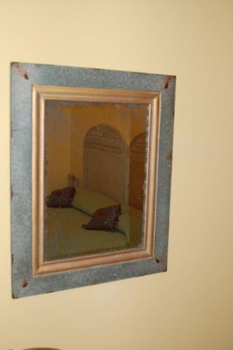 a picture of a mirror on a wall at Albergo Residence Perosi in Tortona