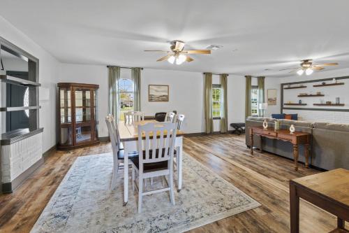 a living room with a table and chairs and a couch at 3 Bedroom Family Home in Lake Charles La in Lake Charles
