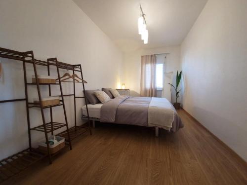 a bedroom with a bed and a book shelf at Schöne 3Zimmer-Wohnung Stadtnah in Derendingen