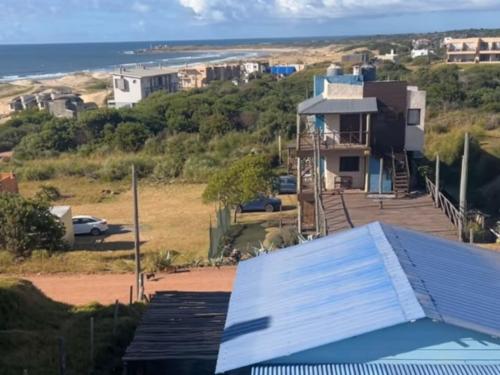 a view of a house with a solar roof at 28 de Octubre in Punta Del Diablo