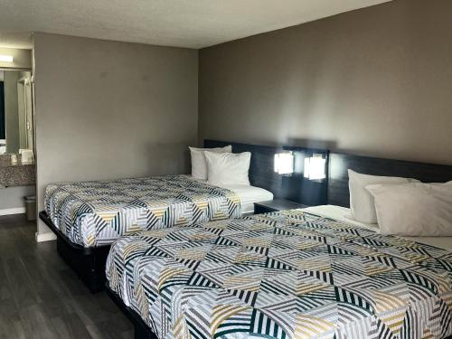 a hotel room with two beds in a room at Motel 6 Lugoff, SC in Lugoff