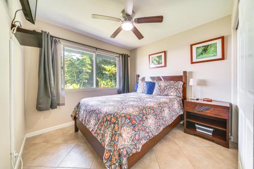 a bedroom with a bed and a window at Hilo Oasis - 32 Mi to Volcanoes National Park! in Hilo