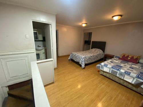 Postel nebo postele na pokoji v ubytování Cómoda Casa Cerca de la playa y el Mall 3B, 3D