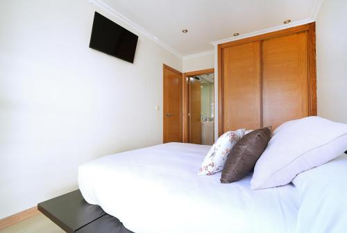 Postel nebo postele na pokoji v ubytování GALIHOST - Apartamento Cesteiros Sanxenxo