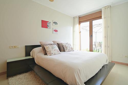 Postel nebo postele na pokoji v ubytování GALIHOST - Apartamento Cesteiros Sanxenxo
