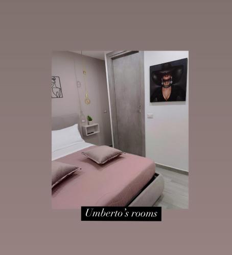 Postel nebo postele na pokoji v ubytování Umbertos Rooms