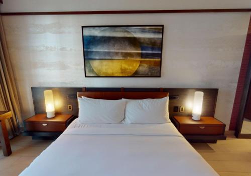 a bedroom with a large bed with two lamps at Nobu Hotel Atlanta in Atlanta