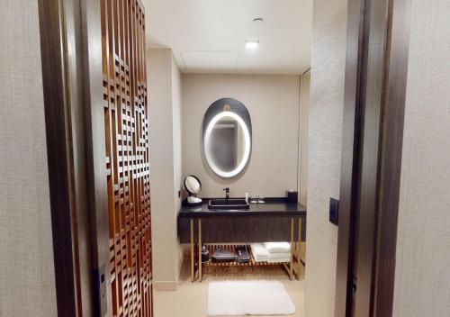 a bathroom with a sink and a mirror at Nobu Hotel Atlanta in Atlanta