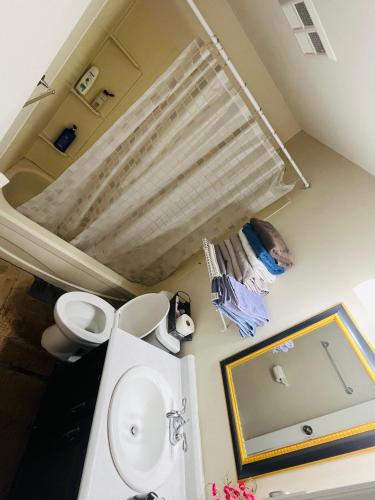 a bathroom with a toilet and a sink at Basement unit with 2 bedrooms, bath and living area in Lower Sackville