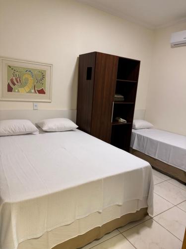 Ένα ή περισσότερα κρεβάτια σε δωμάτιο στο CR Hotel