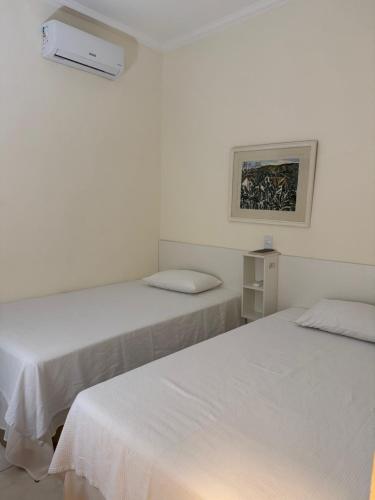 Ένα ή περισσότερα κρεβάτια σε δωμάτιο στο CR Hotel