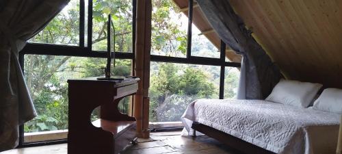 Giường trong phòng chung tại Glamping Manzara