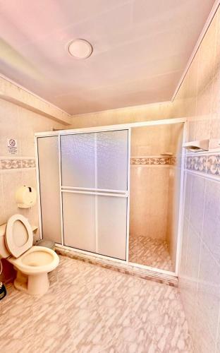 a bathroom with a shower and a toilet at Posada Seven Colours Ocean in Providencia