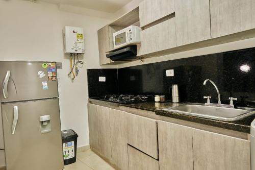 Η κουζίνα ή μικρή κουζίνα στο Apartamentos y Loft Laureles