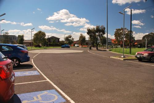 an empty parking lot with parked cars on a street at Pascoe Vale South, Vic, Australia stay with Domi in Melbourne