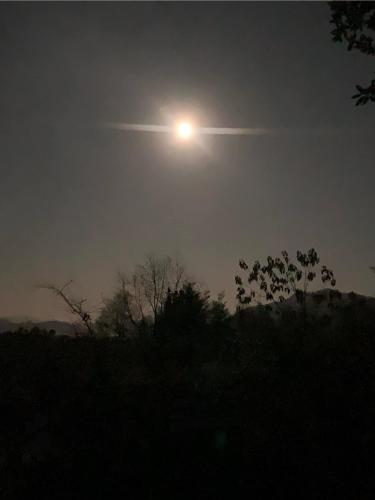 a sun in the sky over a field at night at Chalet con Tinaja LicanRay in Challupen