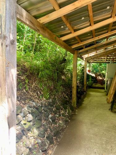 a wooden pergola on top of a house at Chalet con Tinaja LicanRay in Challupen
