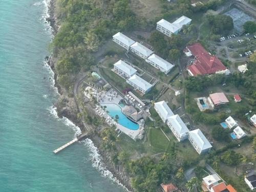 an aerial view of a resort next to the water at Ti-CHERRY in Le Diamant