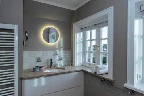 a bathroom with a sink and a mirror at LITZKOW 12806 in Westerwall