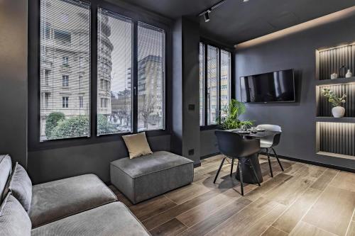 a living room with a couch and a table at Lungolago Modern FD Apartments in Como