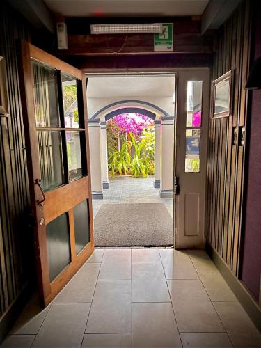 an entrance to a house with an open door at La Blanca Hotel in Viña del Mar