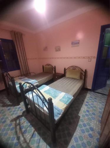 Cama ou camas em um quarto em Khay