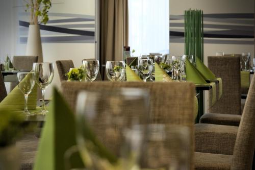 a long table with wine glasses on it at Hotel Euro in Pardubice